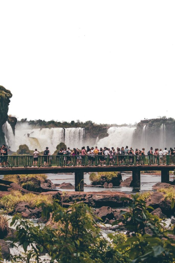 Crowds gather on a bridge to view the majestic Iguazu Falls in Brazil.
