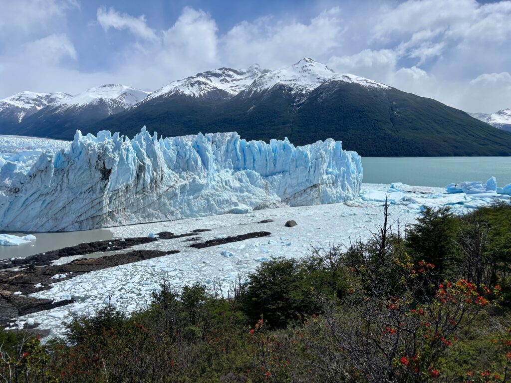 Majestic Perito Moreno Glacier with snow-capped mountains in Patagonia, Argentina.