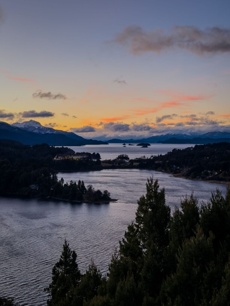 Scenic sunset view over the lake and mountains in Bariloche, Argentina captured during twilight.